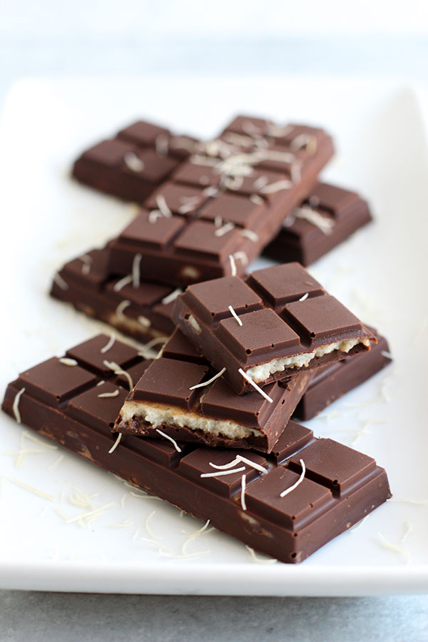 Chocolate bar broken open to show pistachio pudding filling with kataifi